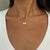Fordham F Necklace on figure
