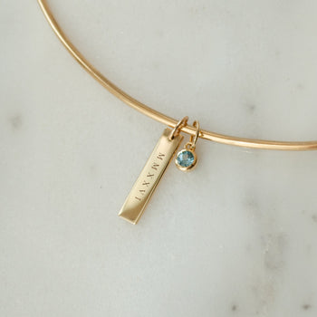 2026 Grad Layering Bar shown on Neck Collar with Blue Topaz Gemstone in gold