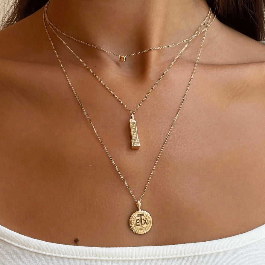 Texas Exes Life Member Sunburst Pendant on figure