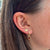 Texas A&M Florentine Earring Bundle shown on figure in gold