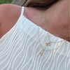 Tennessee T Letter Charm Bundle shown on figure in gold