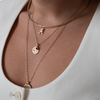 Alabama Logo Charm shown on figure in gold on Neck Collar, with Alabama Sunburst Bundle on Cable Chain