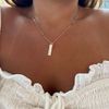 Alpha Chi Omega Bar Bundle shown on figure in gold