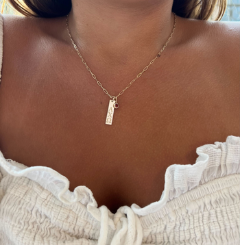 Alpha Chi Omega Bar Bundle shown on figure in gold