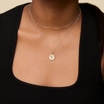 Alpha Phi Sunburst Necklace shown on figure in gold