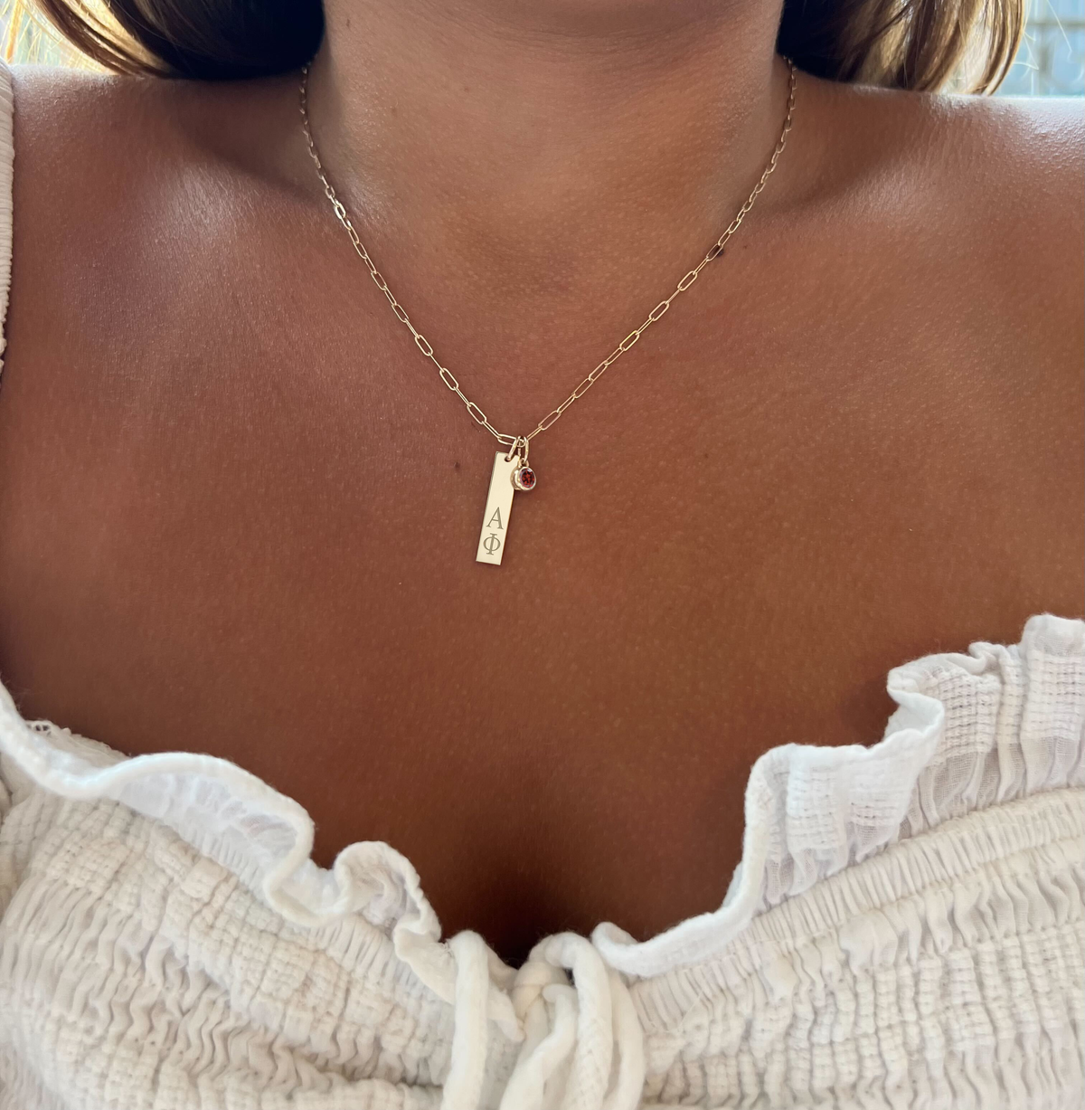 Alpha Phi Bar Bundle shown on figure in gold