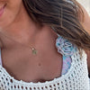 Arkansas Sunburst Pendant shown on figure in gold on Cable Chain
