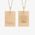 Two gold rectangular pendant necklaces shown side by side on a light gray background. The left pendant is brushed gold with the engraved script text 'Tell the Team Bear Down.
