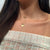 Columbia C Necklace shown on figure in gold