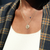 Bucknell 7-Point Diamond Necklace shown on figure with Sapphire Gemstone Necklace