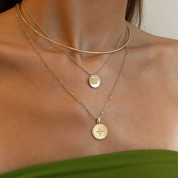 Cathedral Logo Necklace shown on figure in gold with Cathedral Sunburst Pendant on Link Chain, and Neck Collar in gold