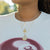 Ohio State Logo Charm shown on figure in gold on Link Chain with Ohio State Sunburst and Ohio State Florentine Necklace