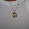 Penn Sunburst Bundle shown on figure in gold with Cable Chain and M Diamond Initial Charm