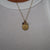 Penn Sunburst Bundle shown on figure in gold with Cable Chain and M Diamond Initial Charm