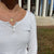 UVA Sunburst shown on figure in gold on Cable Chain