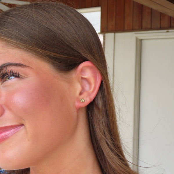 Auburn AU Stud shown on figure in gold