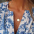 Auburn Sunburst Pendant shown on figure in gold on Cable Chain