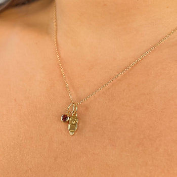 Chi Omega Owl Charm Bundle shown on figure in gold