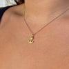 Delta Gamma Anchor Charm shown on figure in gold on Cable Chain