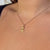 Delta Gamma Anchor Charm shown on figure in gold on Cable Chain