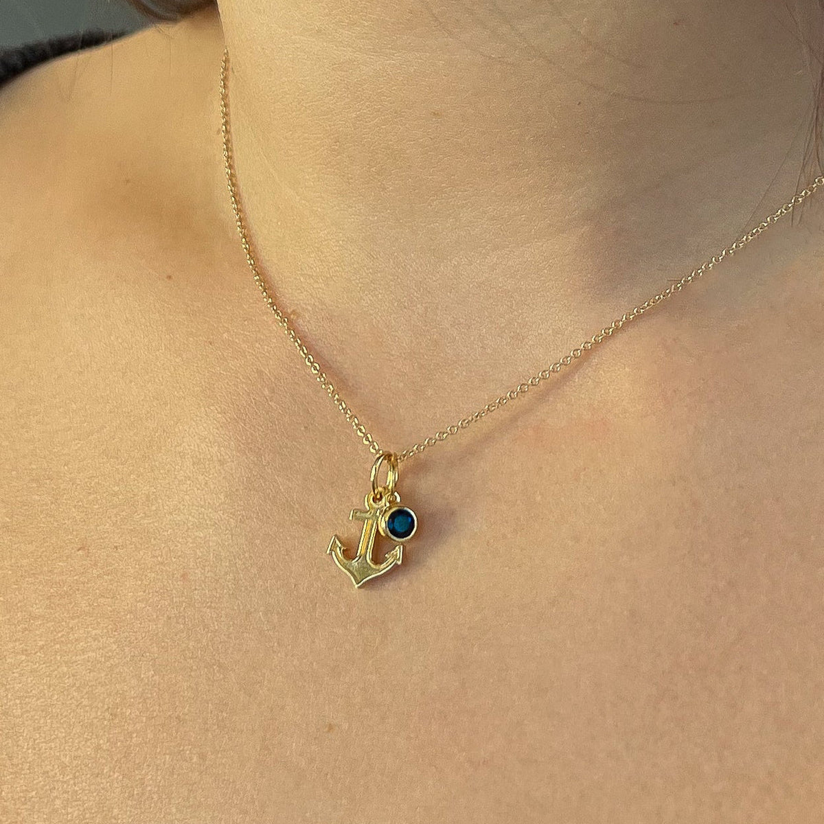 Delta Gamma Anchor Charm Bundle shown on figure in gold