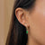 Shamrock Emerald Mini U Earring Bundle shown on figure in gold