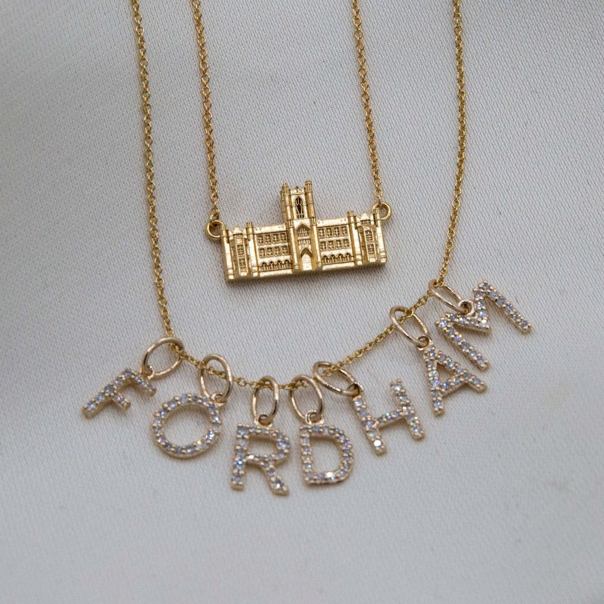 Fordham Keating Hall Necklace shown with Fordham Diamond Letters on Cable Chain in gold laydown