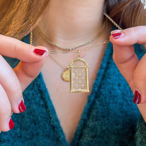 Georgetown Visitation Gate Pendant shown on figure in gold in size Large on Link Chain