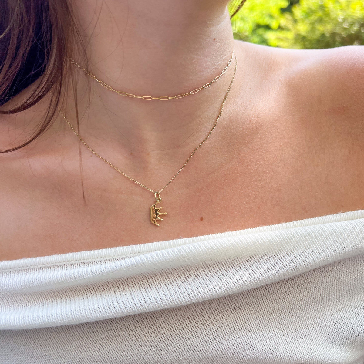 Zeta Tau Alpha Crown Charm shown on figure in gold with Cable Chain and Link Chain Choker