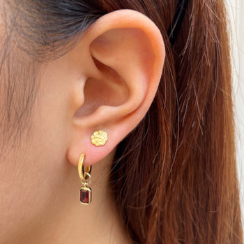 Alpha Omicron Pi Rose Stud Earring shown on figure in gold