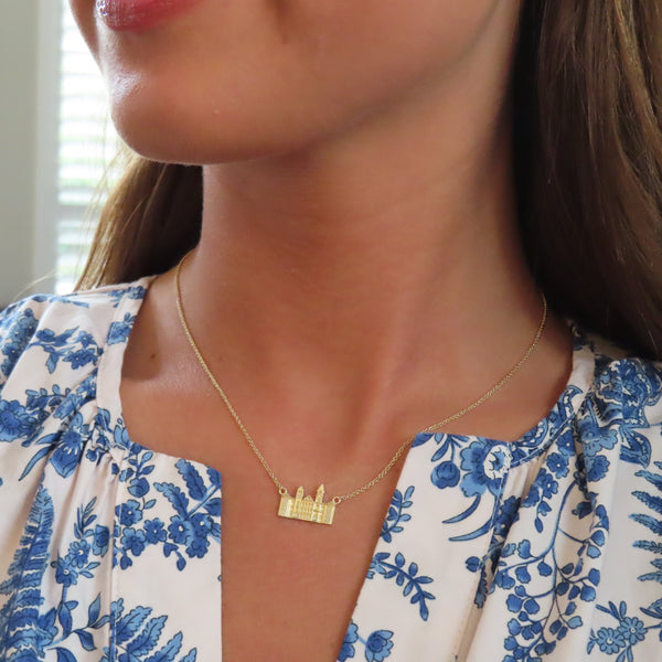 Samford Hall Necklace shown on figure in gold
