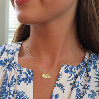 Samford Hall Necklace shown on figure in gold