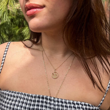Kappa Delta Shell Charm shown on figure in gold on Cable Chain