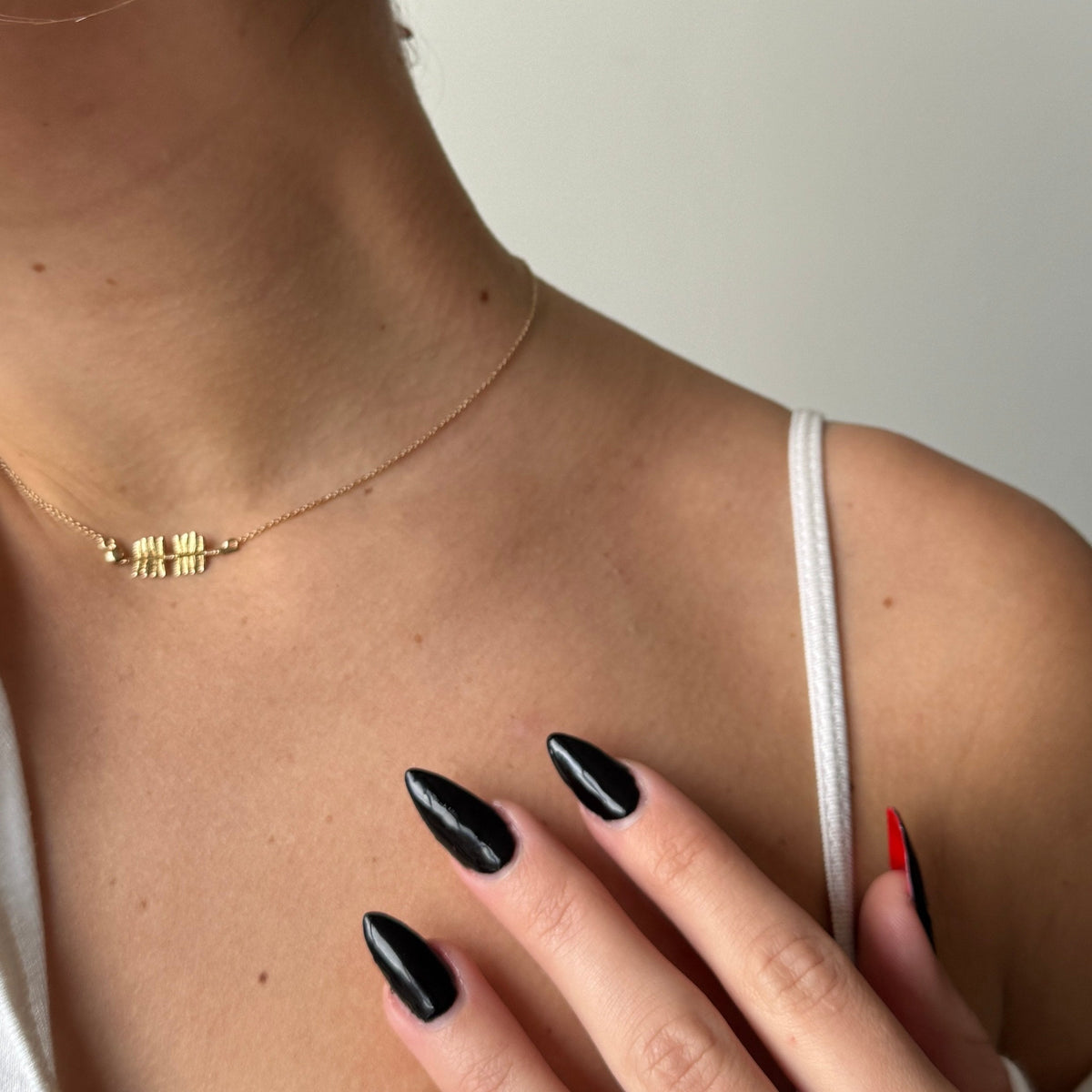 FSU Spear Necklace shown on figure in gold