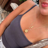 UT Seal Florentine Pendant shown on figure in gold on Link Chain with the UT Tower Pendant on Cable Chain