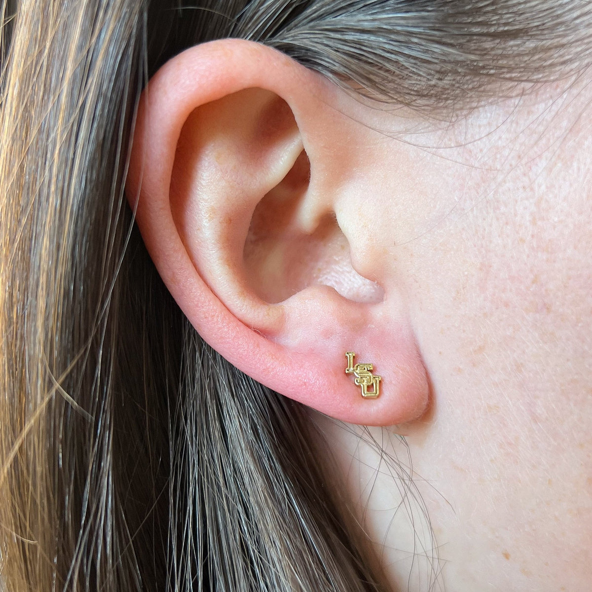 LSU Logo Stud Earring shown on figure in gold