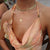 Ole Miss Eye Seal Sunburst Pendant shown on figure in gold on Cable Chain