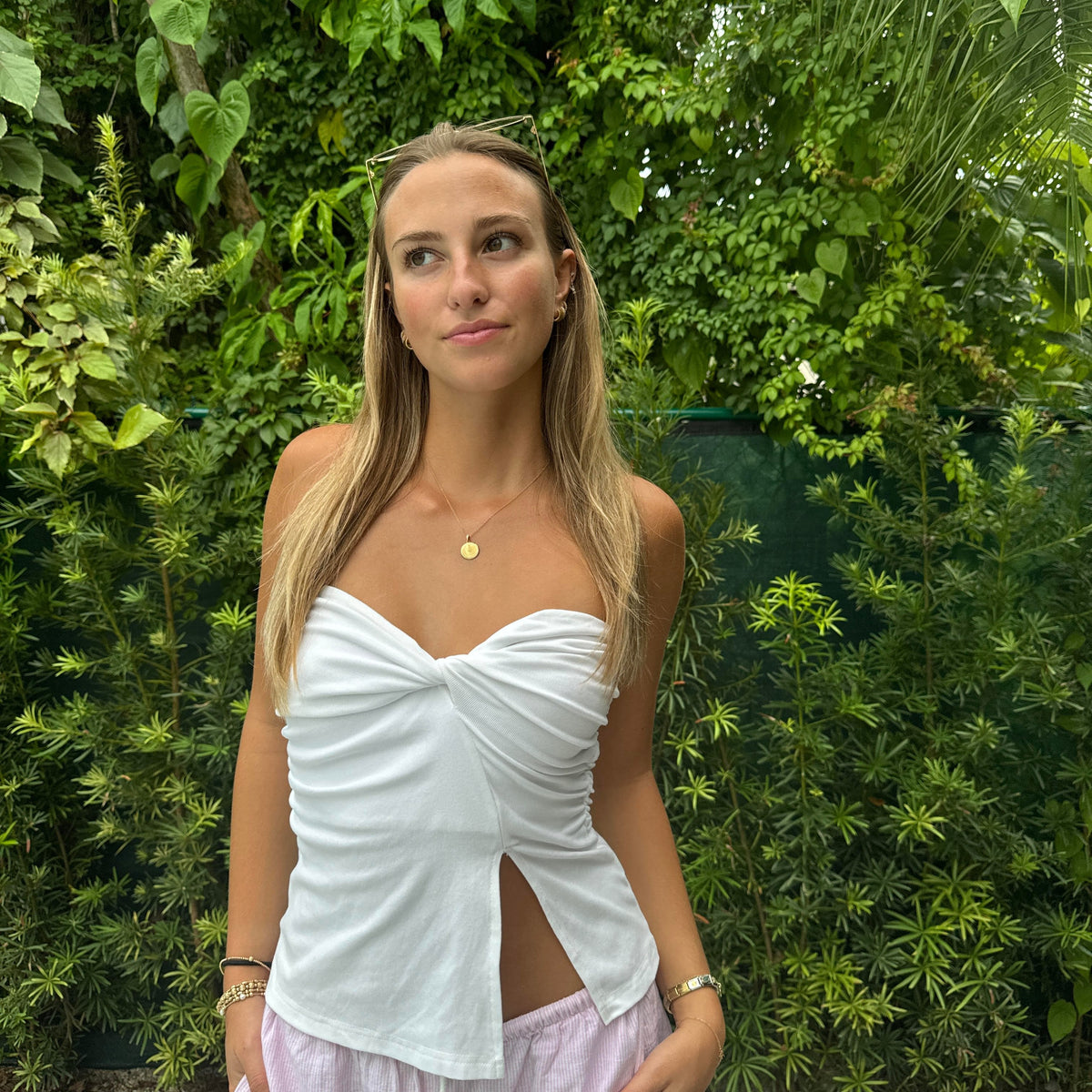 U Miami Sunburst Pendant shown on figure in gold with Cable Chain