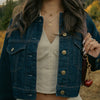 Utah Logo Charm shown on figure in gold on Link Chain with Utah Sunburst Pendant in gold on Cable Chain
