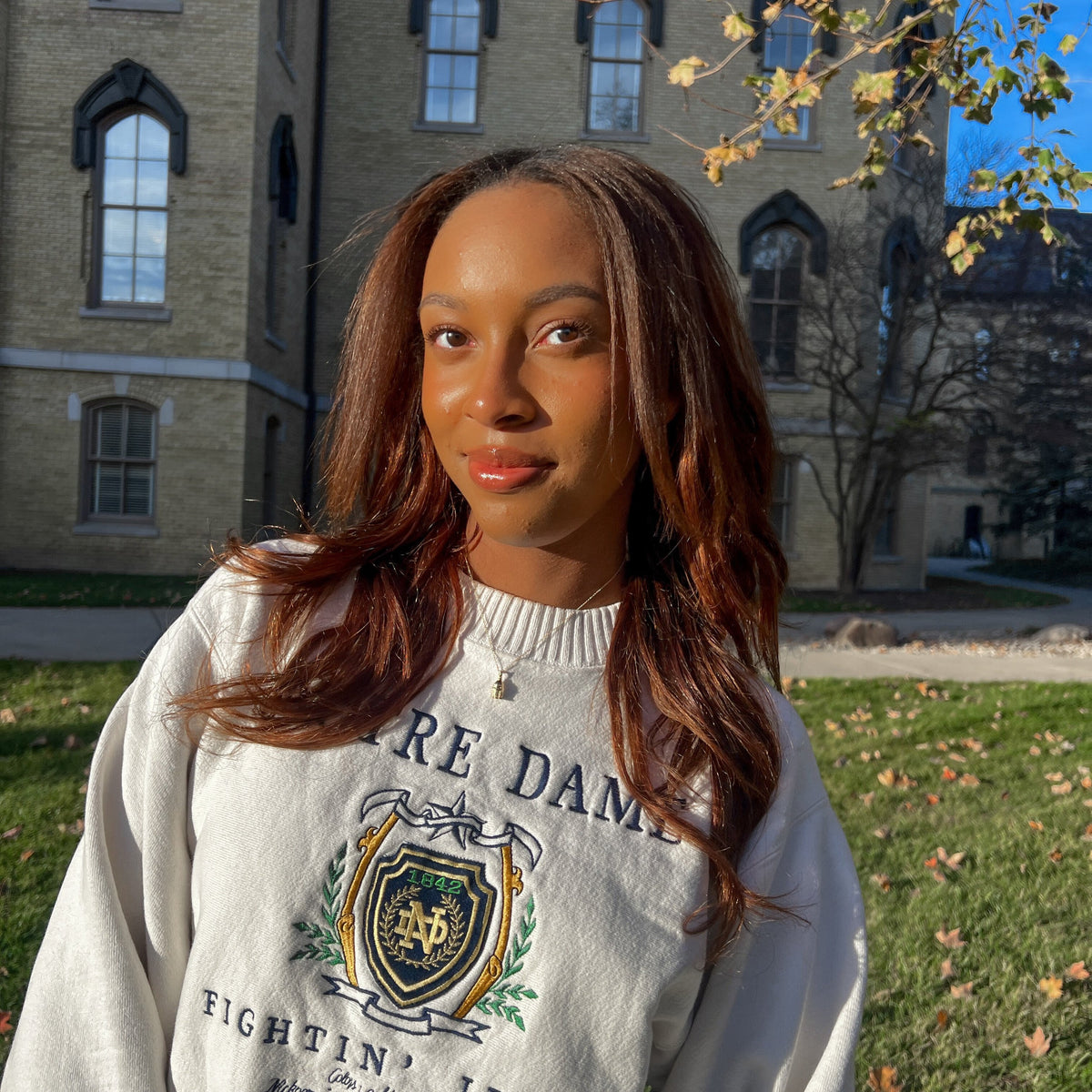 Notre Dame Golden Dome shown on figure in gold on Cable Chain