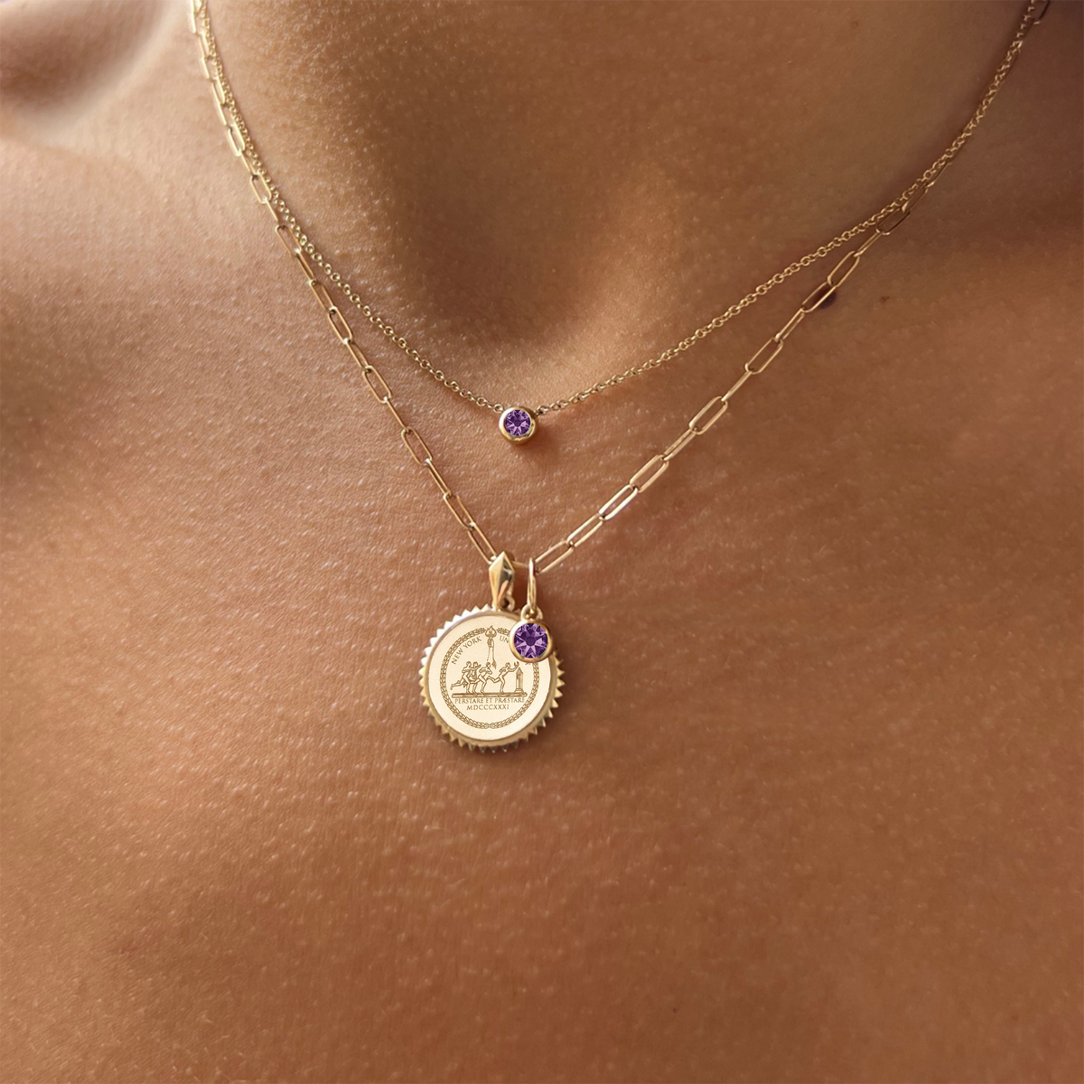 NYU Sunburst Bundle shown on figure in gold with Amethyst Gemstone Necklace