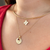 Nebraska Logo Charm shown on figure in gold on Neck Collar with Nebraska Sunburst Bundle 