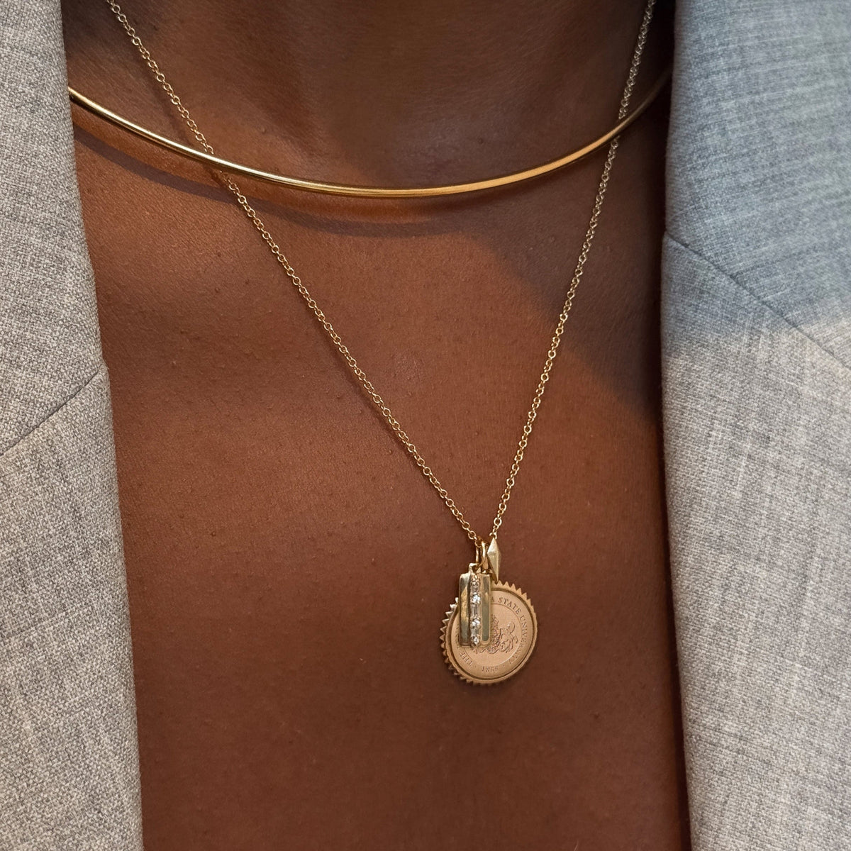 North Star Line Bar Charm shown on figure in gold with Penn State Sunburst on Cable Chain and Neck Collar in gold