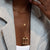 North Star Heart Lock Charm shown on figure in gold on Link Chain with Neck Collar and UGA Large Arch Pendant on Cable Chain