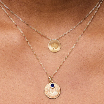 Notre Dame Sunburst Bundle shown on figure in gold with Organic Necklace