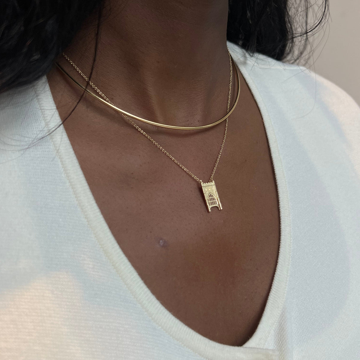Notre Dame Law School Pendant shown on figure in gold with Neck Collar