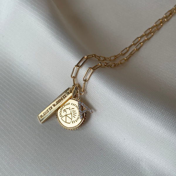Purdue Sunburst Necklace shown in gold with Coordinates Bar and Diamond Letter A on Link Chain laydown