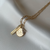 Purdue Sunburst Necklace shown in gold with Coordinates Bar and Diamond Letter A on Link Chain laydown