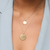 Petite Florentine Pendant shown on figure in gold on Cable Chain with Large Florentine Pendant in gold on Cable Chain