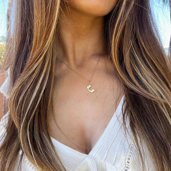 U Miami U Letter Charm shown on figure in gold on Cable Chain